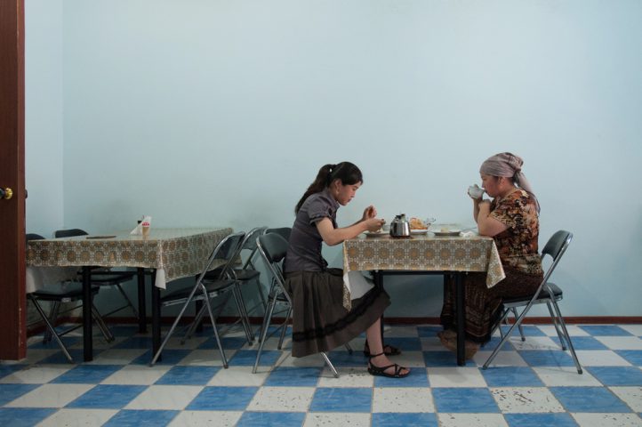 Local residents having a mean at a cafe. Mailuu-Suu, Kyrgyzstan 2012